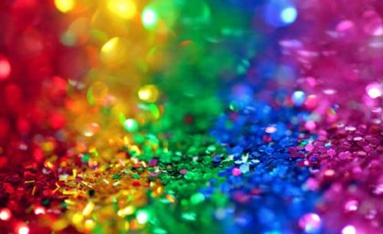 Piles of sequins in the colours of the rainbow flag. Image: Pexels/Sharon McCutcheon